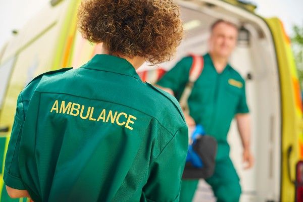 Image of paramedics outside an ambulance